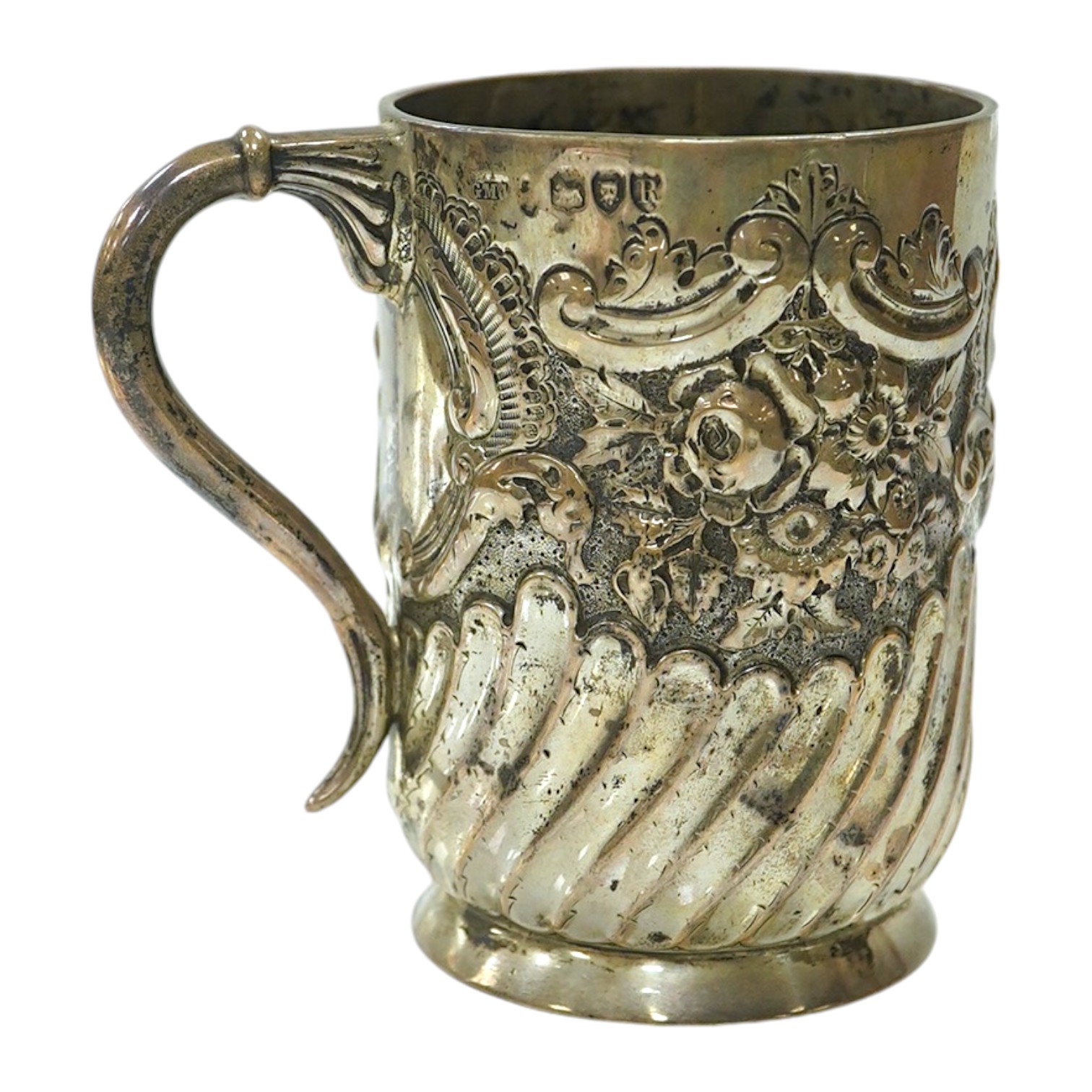 A late Victorian demi- wrythened fluted and embossed christening mug, by Josiah Williams & Co, London, 1892, 94mm, 4.6oz. Condition - poor to fair